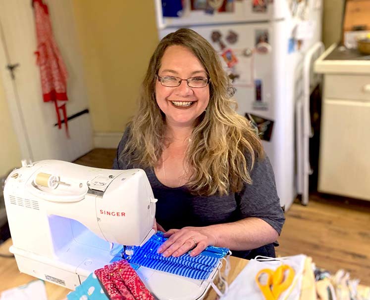 Kathleen Thomas sews