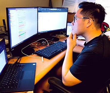 Martin Nguyen looking into monitor
