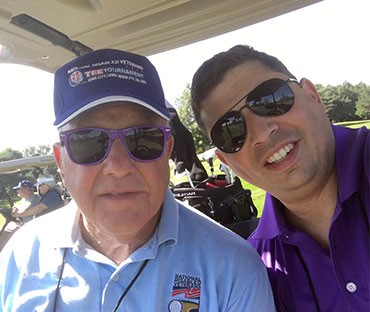 With a new friend at the Disabled American Veterans golf tournament sponsored by the firm and the Veterans at Grant Thornton BRG