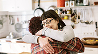 Mother hugging son